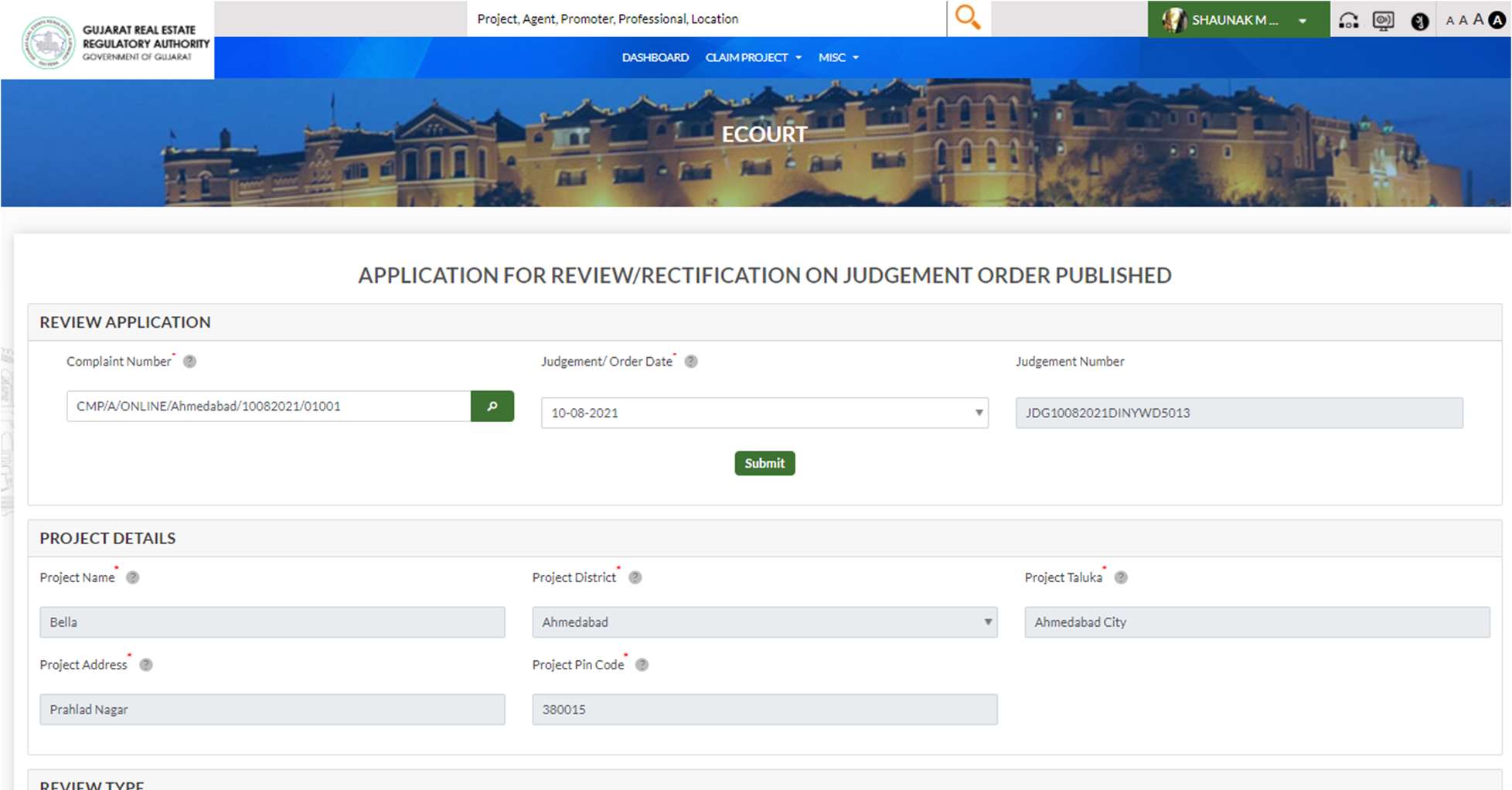 GujRERA Review Rectification application form showing auto-filled Project Details section (project name, Ahmedabad, Prahlad Nagar, 380015) and REVIEW TYPE radio button selection